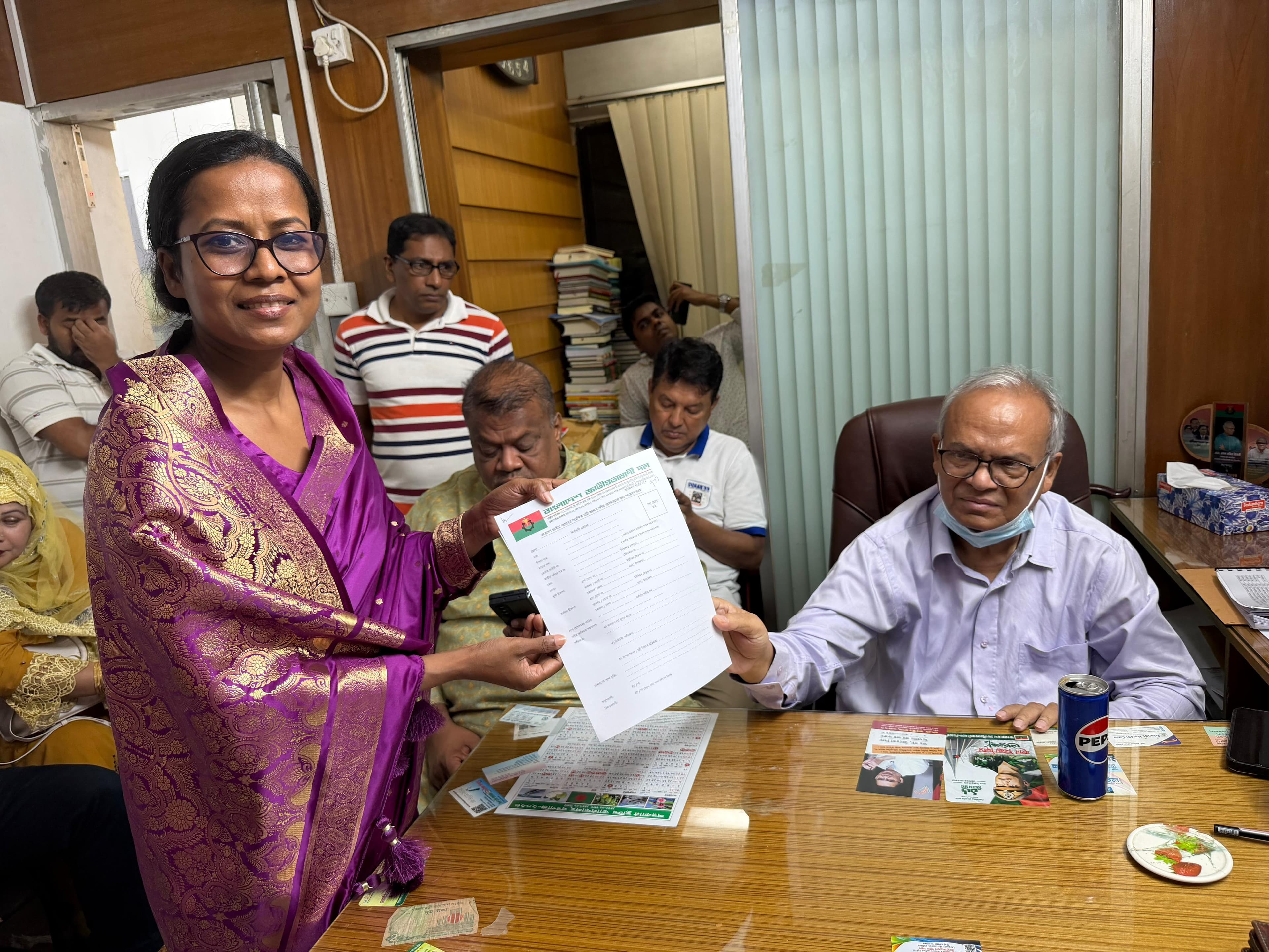 Receiving the BNP nomination form from Ruhul Kabir Rizvi